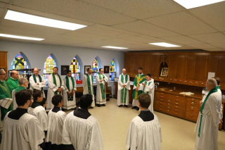 Priests and Altar Servers preparing for Mass.